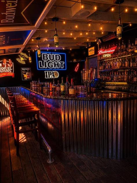 Inside Charlee's Bar in Elko, Nevada — bar area with neon signs, string lights, and whiskey shelves